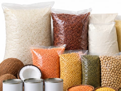 Clear wholesale bags of white rice, red rice, flour and parboiled rice.